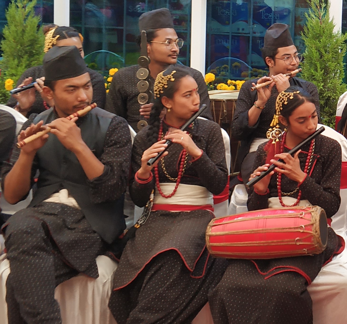 Nepali ensemble playing side-blown bamsuri flutes with madal accompaniment